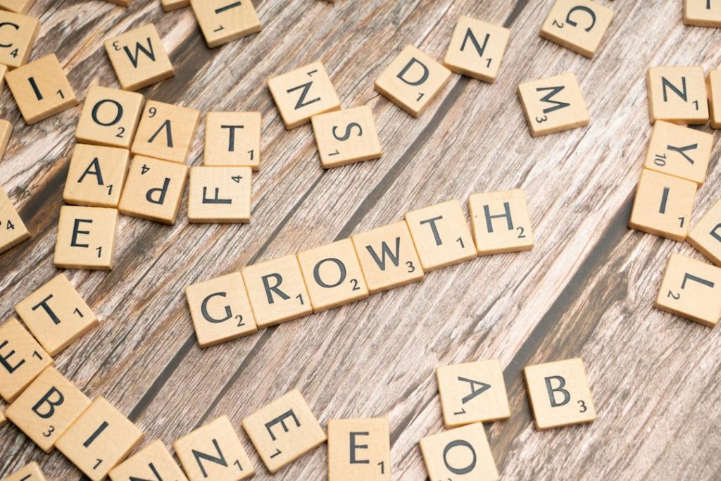 scrabbled-letters-spelling-growth-on-a-wooden-surface-0m-ixoa5wbo